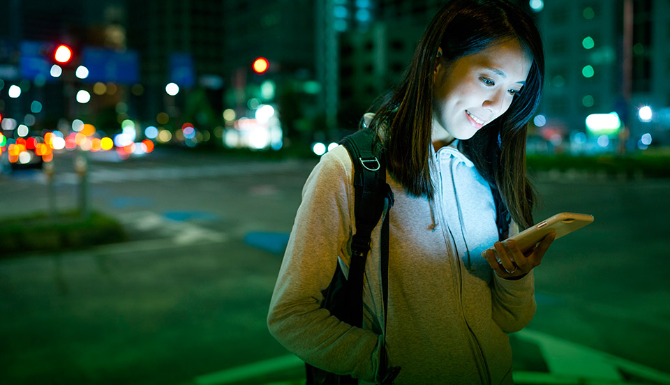 Picture of a girl looking at her phone